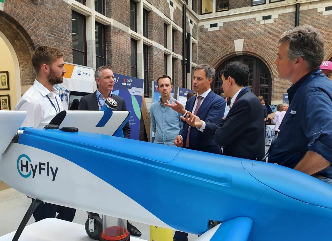The Prime Minister of Belgium, Alexander De Croo, views the HyFly hydrogen drone during the SAFIR-Med executive event.